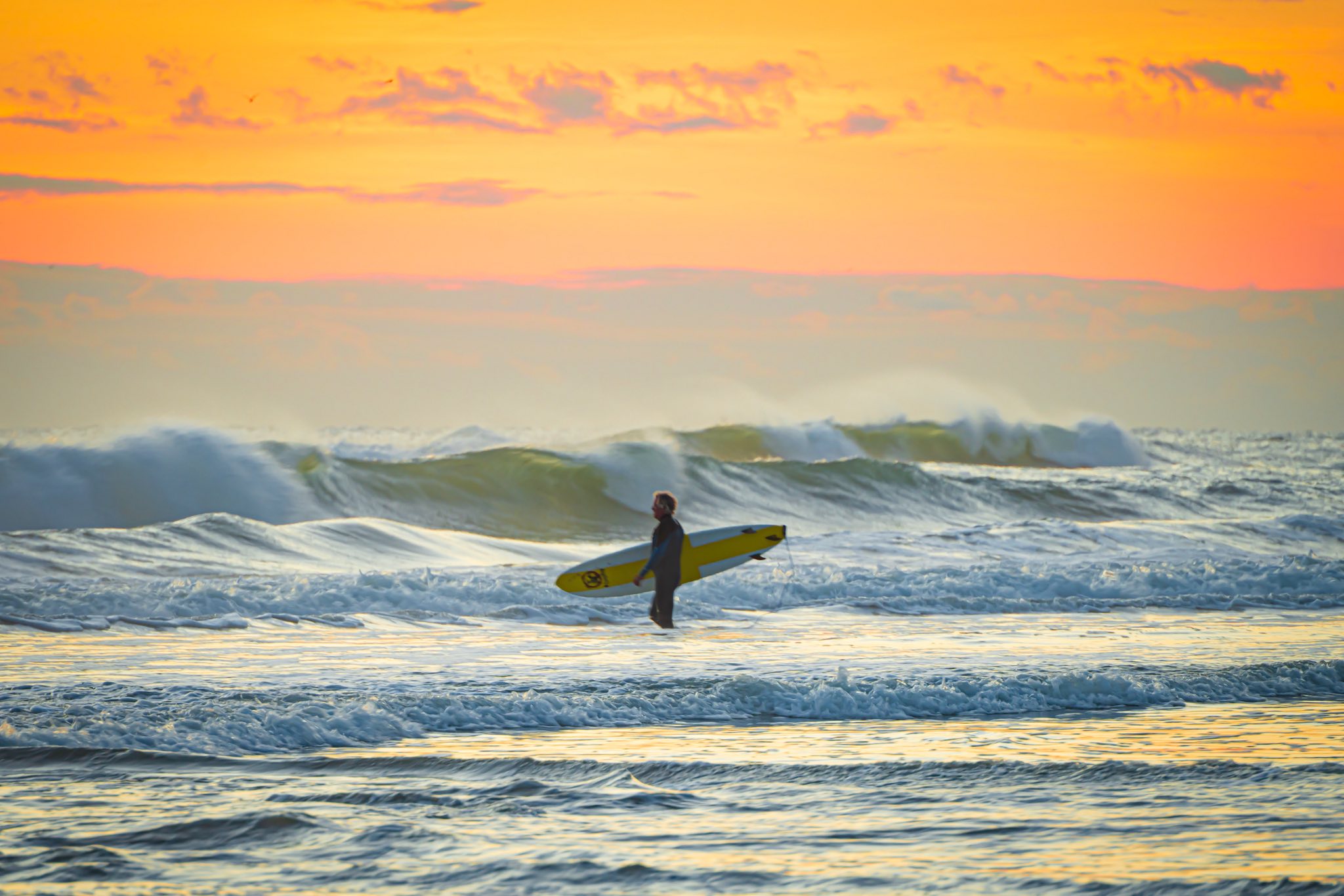 Surfer headed out